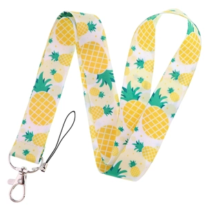 Pineapple patterned fabric phone lanyard with metal lobster clasp on white background