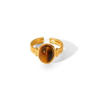 Detail of oval tiger eye stone set in a vintage gold-plated stainless steel open ring