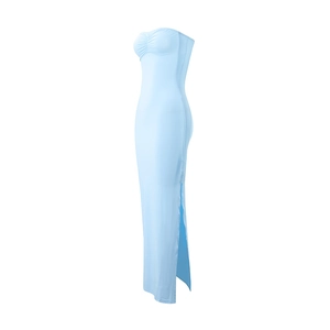 Side view detail of a light blue strapless bodycon maxi dress with a sexy high side slit