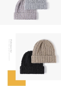 Close-up of textured knit beanie showing thick wool-like fabric in four assorted colors