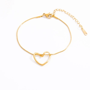 Detailed view of golden stainless steel heart pendant and snake chain with lobster clasp