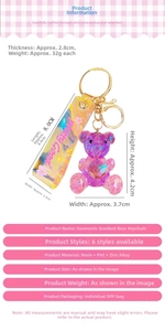 Detailed view of pink gradient geometric bear keychain with PVC wrist strap and dimensions