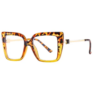 Oversized tortoise shell cat eye glasses with gold metal temples and square accents