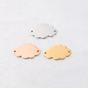 Detailed view of cloud pendants in silver, gold, and rose gold mirror stainless steel