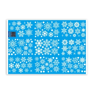 White snowflake window stickers set with various sizes on a solid blue background