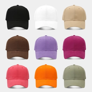 Nine solid colored baseball caps with structured crowns and curved brims in various vibrant hues