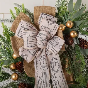 Rustic Christmas wreath with pine cones, golden bells, and festive burlap bow decoration