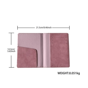 Pink PU leather passport holder showing internal layout and 21.5cm by 14.3cm dimensions
