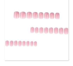Close-up of pink and white gradient press-on nails with silver glitter French tips