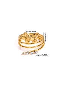 Detailed view of a gold spiral ring featuring a sparkling rhinestone butterfly charm