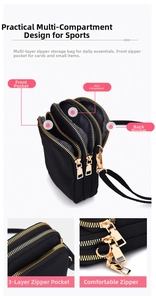 Detailed view of black nylon phone bag showing triple zipper compartments and golden hardware