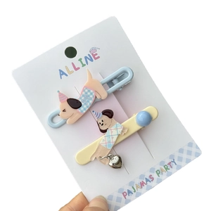 Cute acrylic dog hair clips in sky blue and yellow colors with heart pendants