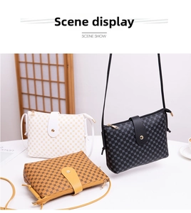 Three bucket bags in black, white, and yellow with geometric dot texture on a table