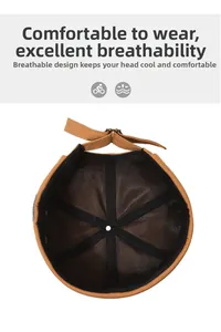 Detail of brown cotton docker hat with breathable black mesh lining and adjustable strap