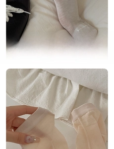 Detail of thin silk women's socks showing breathable mesh fabric and elastic ribbed cuffs