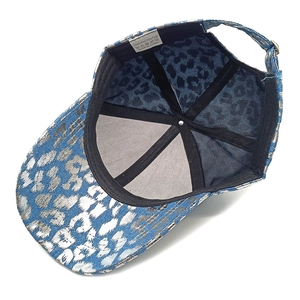 Detailed inner lining of the leopard print baseball cap featuring 100% polyester fabric