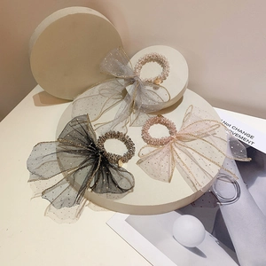Fairy style sequined mesh bow hair ties in grey, black, and pink with sparkling accents