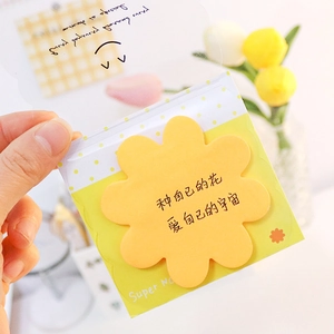 Cute yellow flower-shaped sticky note with inspirational text on a polka dot backing card