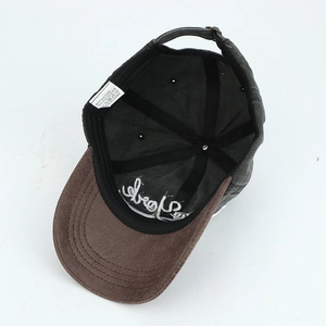 Detail of the internal cotton-blend fabric, washing label, and stitching of the baseball cap