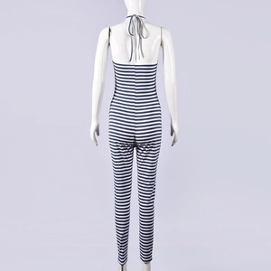 Back view of a striped halter neck jumpsuit with backless design on a mannequin