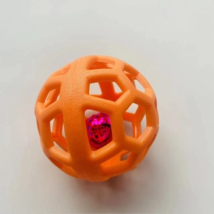 Hollow dog toy ball in orange TPR rubber with a pink bell ball for pets and cats