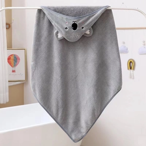 Detail of coral fleece hooded baby towel with a cute grey koala embroidery design