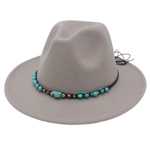 Gray felt cowboy hat with bohemian turquoise beaded band on a clean white background