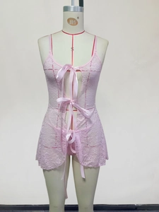 Detailed view of pink floral lace nightgown with satin bow ribbons and sheer texture