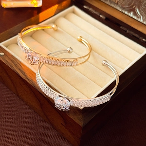 Double-layer geometric floral open bracelet with cubic zirconia in gold and silver finish