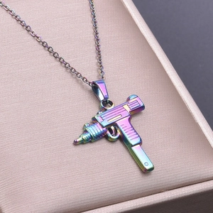 Detailed macro view of Uzi gun pendant featuring a vibrant colorful gradient finish