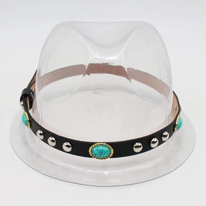 Detail view of black faux leather hat band with turquoise stones and silver studs