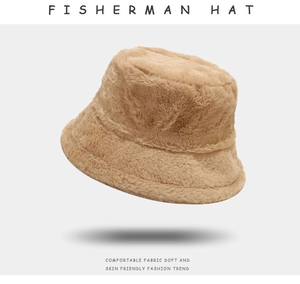 Detail view of the thick plush fabric and soft texture on this camel fisherman hat