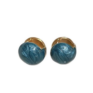 Peacock blue round stud earrings with gold textured spiral pattern on white backdrop