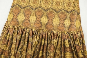 Macro detail of geometric print fabric with fine pleats and high-quality stitching