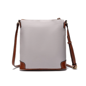 Detail of vintage pebble grain crossbody bag with grey leather and brown stitched trim