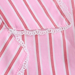 Pink striped shirt with white lace trim detail showing fabric texture and sweet girl style