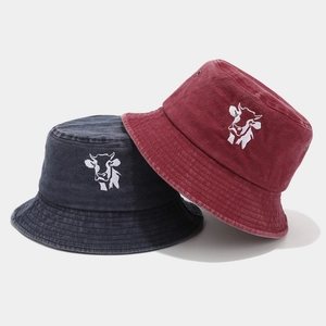 Washed cotton bucket hats with cow embroidery in burgundy and charcoal grey
