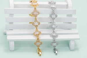 Minimalist petal bracelet with zircon insets available in gold and silver finishes