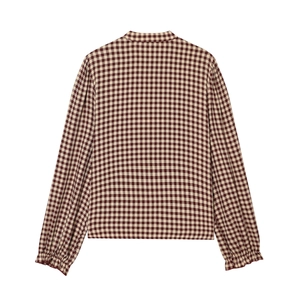 Back view of brown plaid long sleeve shirt with tiered ruffles and small stand collar