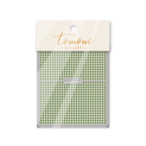 Detail view of green plaid nail stickers MS-37 in professional retail packaging