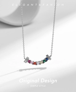 Macro detail of S925 silver necklace with seven multicolored square zircon stones