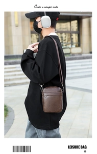 Deep brown PU leather crossbody bag featuring front zipper pocket and adjustable strap