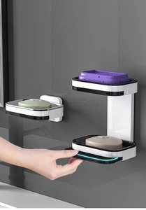 Detail of wall-mounted double-layer soap dish with drawer drainage and gray bathroom decor