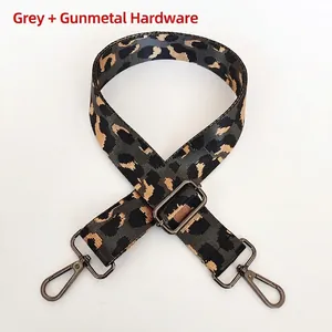 Detail of grey leopard print nylon shoulder strap with adjustable gunmetal swivel hooks