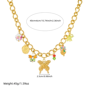 Detail of gold chain necklace with butterfly and flower charms with weight and size info