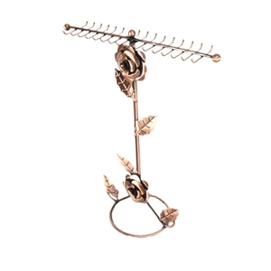 Antique bronze metal rotating necklace stand with rose design on white background