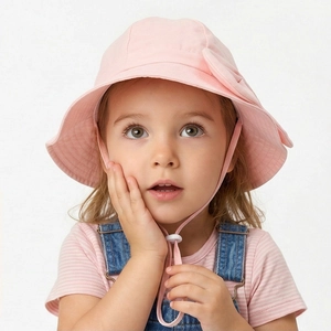 Pink kids sun hat with bow detail and adjustable drawstring for summer protection