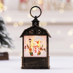 Christmas lantern decoration with snowman scene and flickering flame LED light