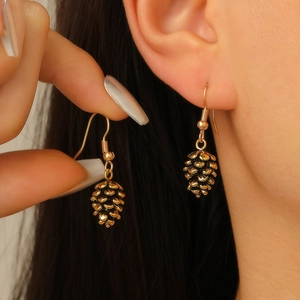 Bohemian vintage pinecone drop earrings in gold-tone metal for a natural aesthetic