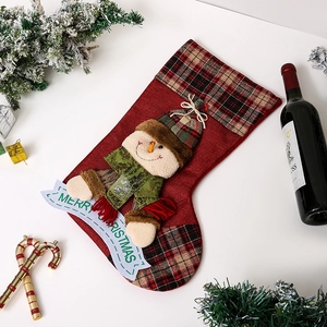 Detail of Christmas stocking featuring a 3D snowman with Merry Christmas banner decor